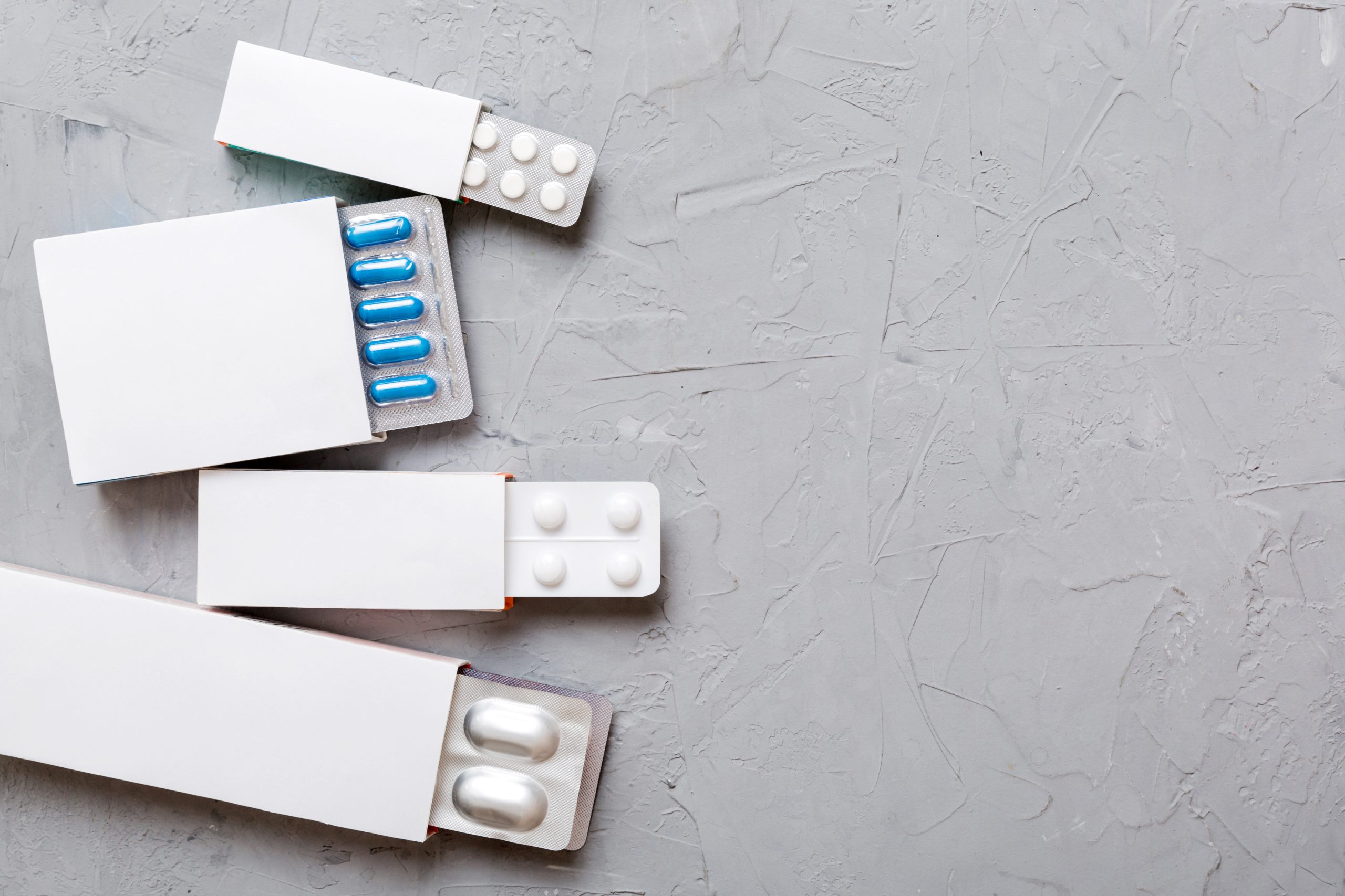 Blank White Product Package Box Mock-up. Open blank medicine drug box with blister top view Blank White Product Package Box Mock-up. Open blank medicine drug box with blister top view.